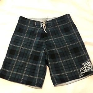 - Da Hui Boardshorts  Size 36. Navy Blue  Plaid.